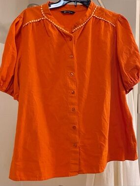 An Orange Short Sleeve Cotton Button Down Shirt.  Size XL. Outlined.